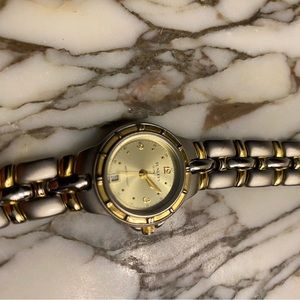 Tunlees Quartz Stainless Steel Watch with electroplated gold accents.